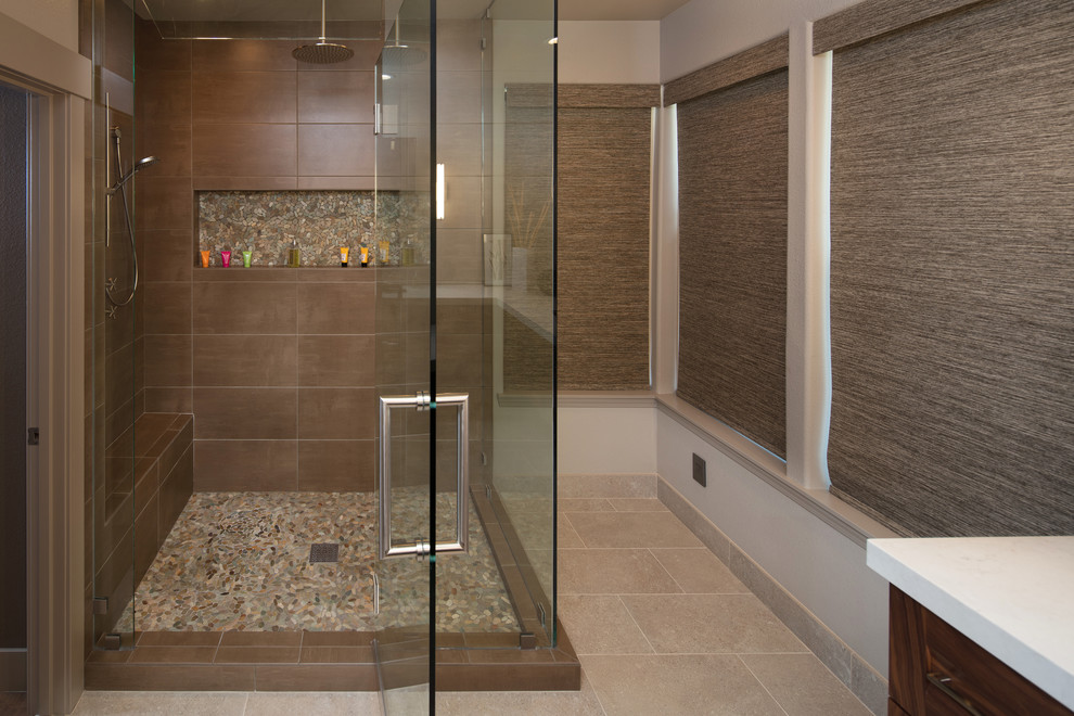 Design ideas for a mid-sized contemporary master bathroom in San Luis Obispo with recessed-panel cabinets, dark wood cabinets, a corner shower, beige walls, porcelain floors, an undermount sink, quartzite benchtops, grey floor and a hinged shower door.