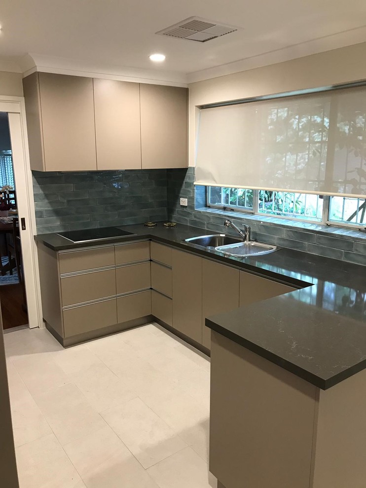 Inspiration for a mid-sized modern u-shaped separate kitchen in Canberra - Queanbeyan with a double-bowl sink, flat-panel cabinets, beige cabinets, quartz benchtops, blue splashback, ceramic splashback, panelled appliances, ceramic floors, yellow floor and orange benchtop.