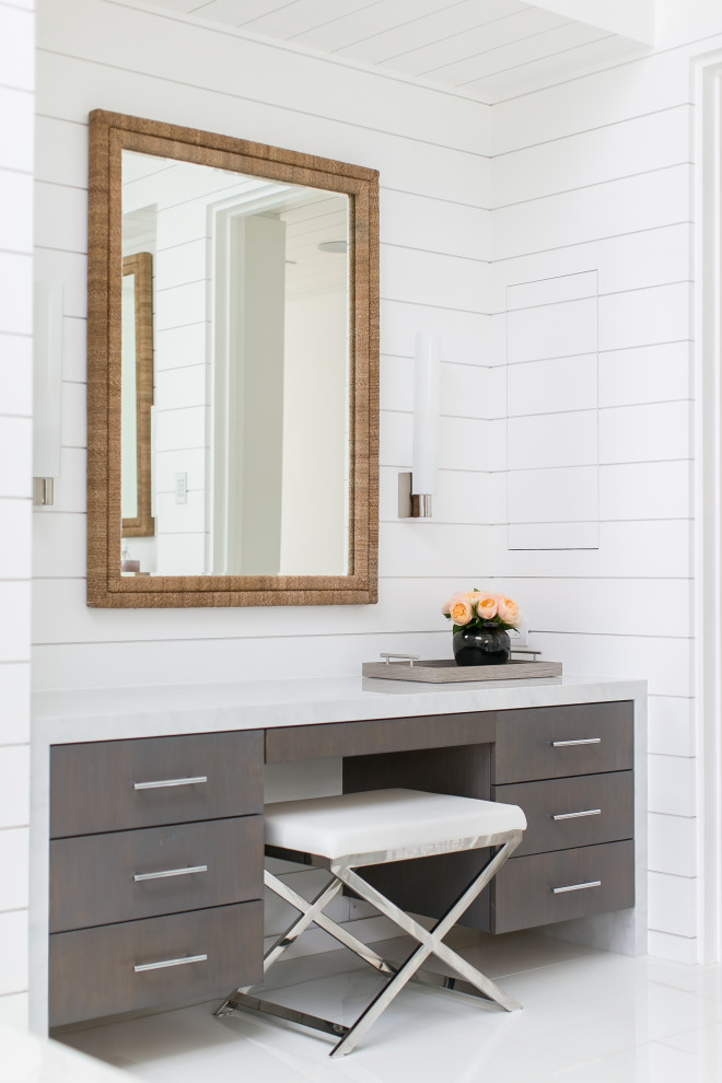 This is an example of an expansive beach style master bathroom in Orange County with flat-panel cabinets, grey cabinets, white walls, marble benchtops, white floor and white benchtops.