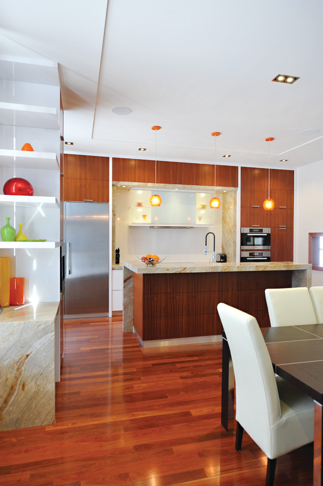 Inspiration for a mid-sized transitional single-wall medium tone wood floor eat-in kitchen remodel in Toronto with a double-bowl sink, flat-panel cabinets, medium tone wood cabinets, granite countertops, multicolored backsplash, stone slab backsplash, stainless steel appliances and an island