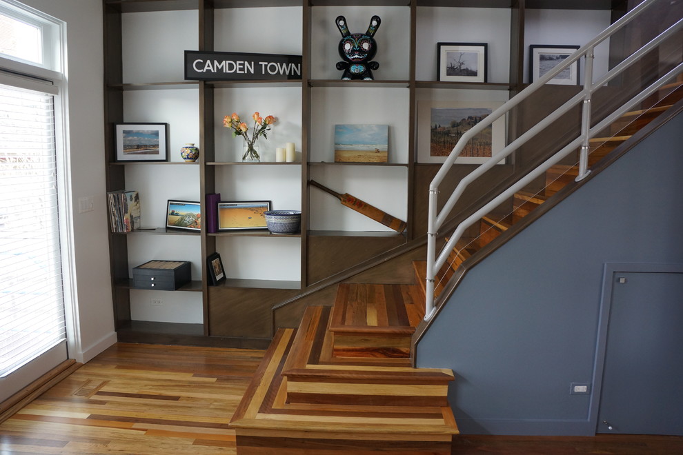 This is an example of a contemporary wood staircase in Chicago with wood risers.