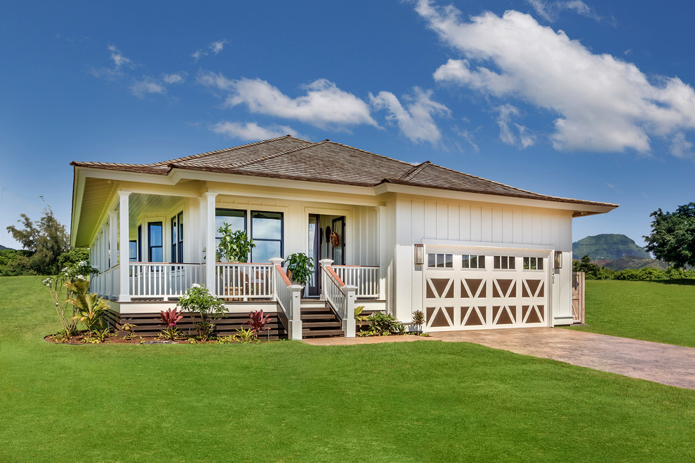 Photo of a mid-sized beach style one-storey white house exterior in Hawaii with wood siding, a hip roof and a shingle roof.