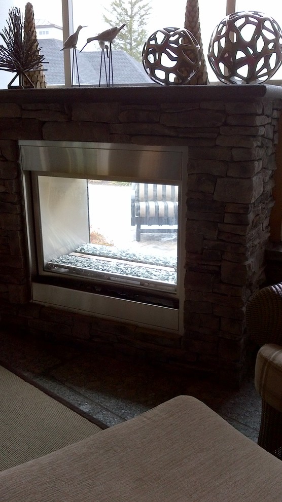 Home design - large transitional backyard stone screened-in home design idea in Toronto with a roof extension