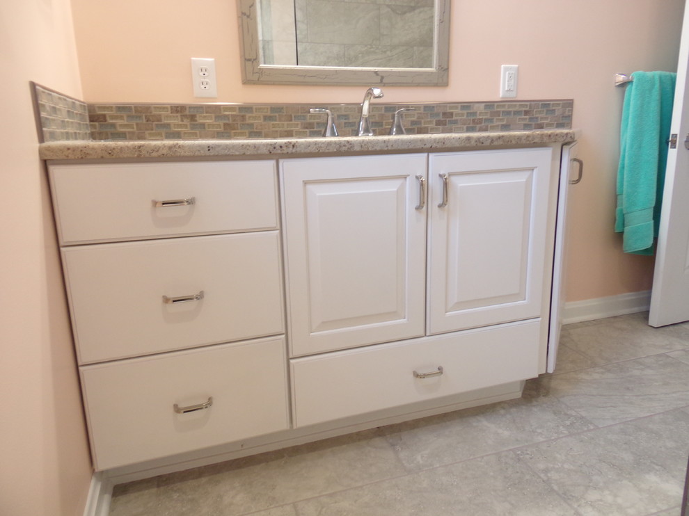 Example of a mid-sized transitional kids' gray tile and porcelain tile porcelain tile alcove bathtub design with an undermount sink, raised-panel cabinets, white cabinets, granite countertops and orange walls