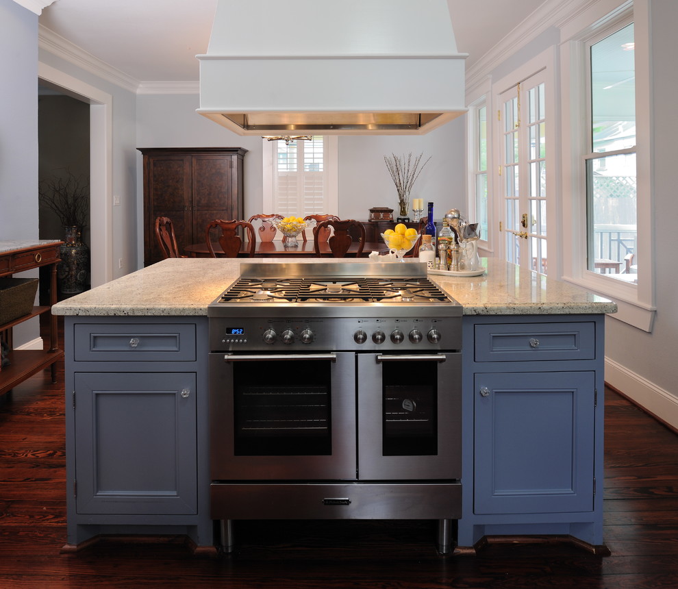 Inspiration for a traditional eat-in kitchen in Houston with stainless steel appliances, recessed-panel cabinets, blue cabinets and granite benchtops.