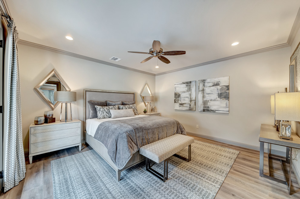 Inspiration for a large transitional guest bedroom in Dallas with grey walls, medium hardwood floors and brown floor.