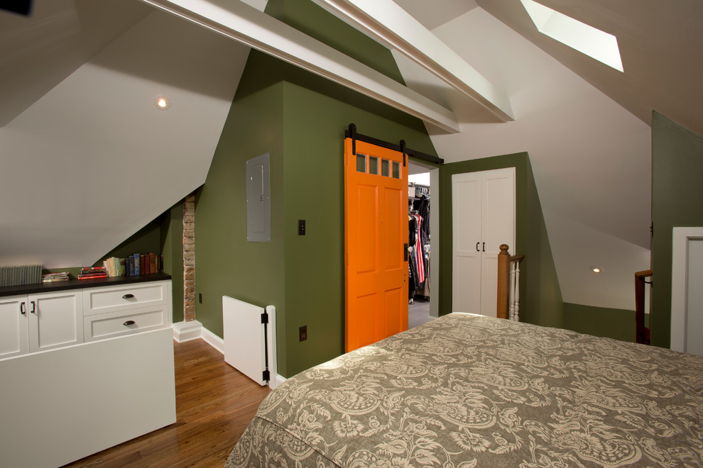 Mid-sized eclectic master bedroom in DC Metro with green walls and medium hardwood floors.