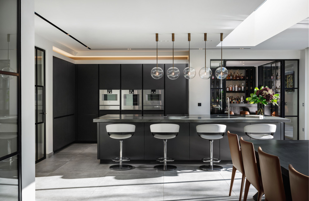 This is an example of a contemporary kitchen in Other with integrated appliances and an island.