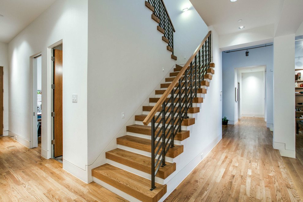 Design ideas for a large contemporary l-shaped staircase in Dallas with wood risers.
