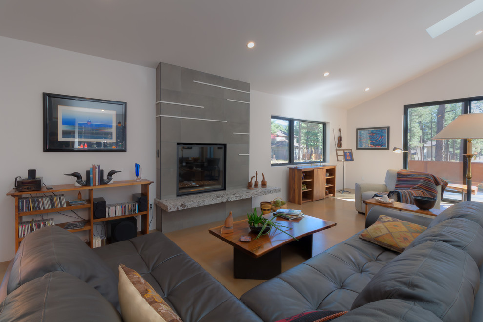 Large transitional open concept light wood floor and beige floor living room photo in Phoenix with white walls, a standard fireplace, a plaster fireplace and a wall-mounted tv