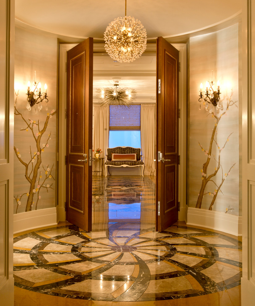Photo of a transitional vestibule in Chicago with a double front door and a medium wood front door.