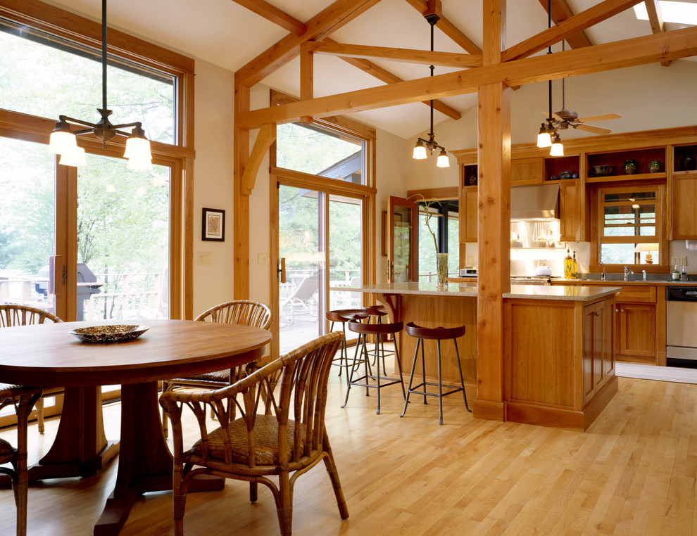 Large mountain style l-shaped light wood floor and beige floor open concept kitchen photo in San Francisco with an undermount sink, shaker cabinets, medium tone wood cabinets, granite countertops, beige backsplash, stainless steel appliances and an island