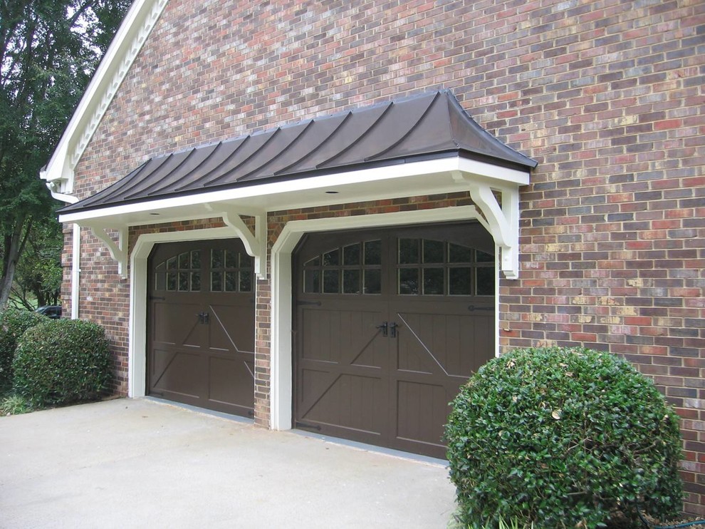 Inspiration for a mid-sized traditional attached two-car garage in Atlanta.