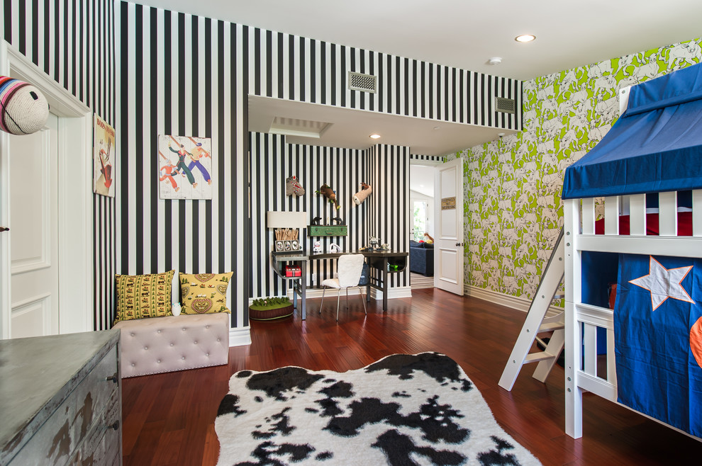 Mediterranean gender-neutral kids' playroom in Los Angeles with multi-coloured walls and dark hardwood floors.