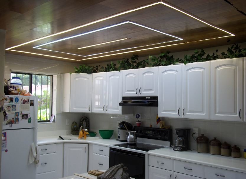 Enclosed kitchen - modern l-shaped enclosed kitchen idea in Orange County with recessed-panel cabinets and white cabinets