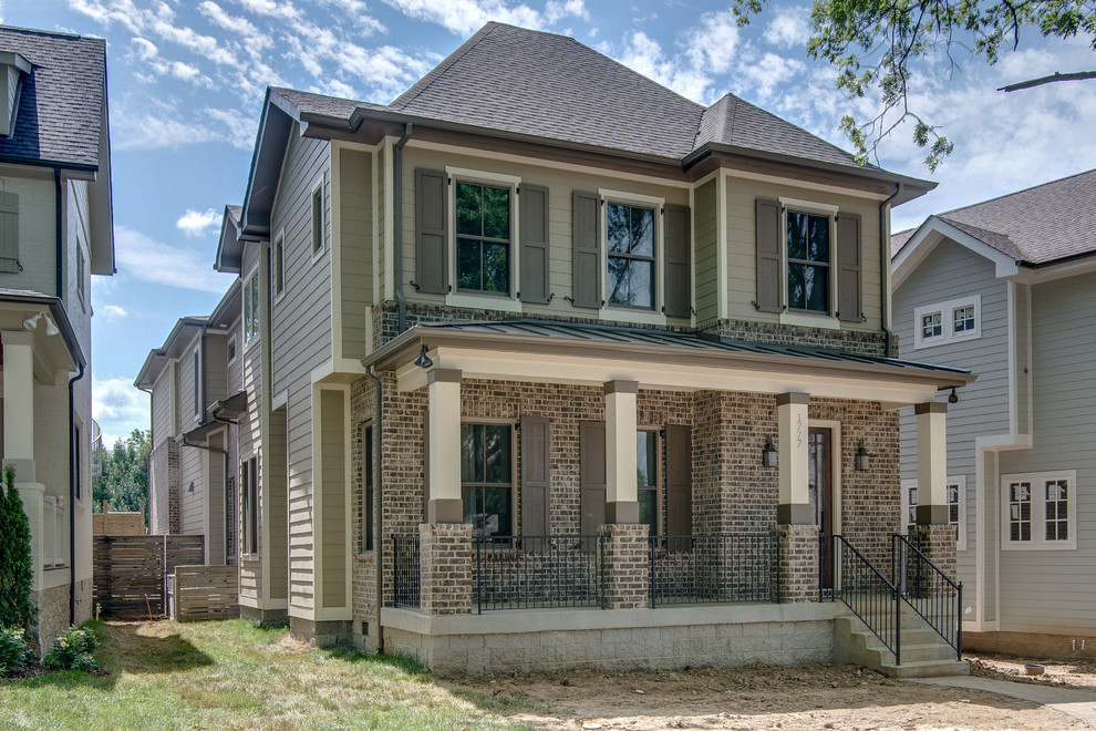 Inspiration for a large transitional brown two-story mixed siding exterior home remodel in Nashville with a hip roof