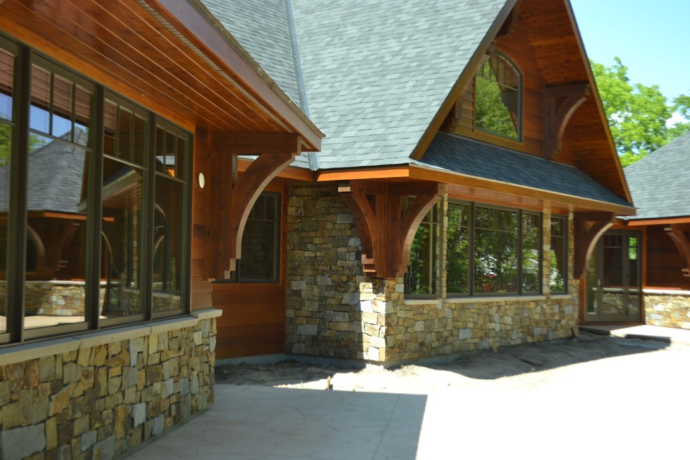 Example of a mountain style home design design in Minneapolis