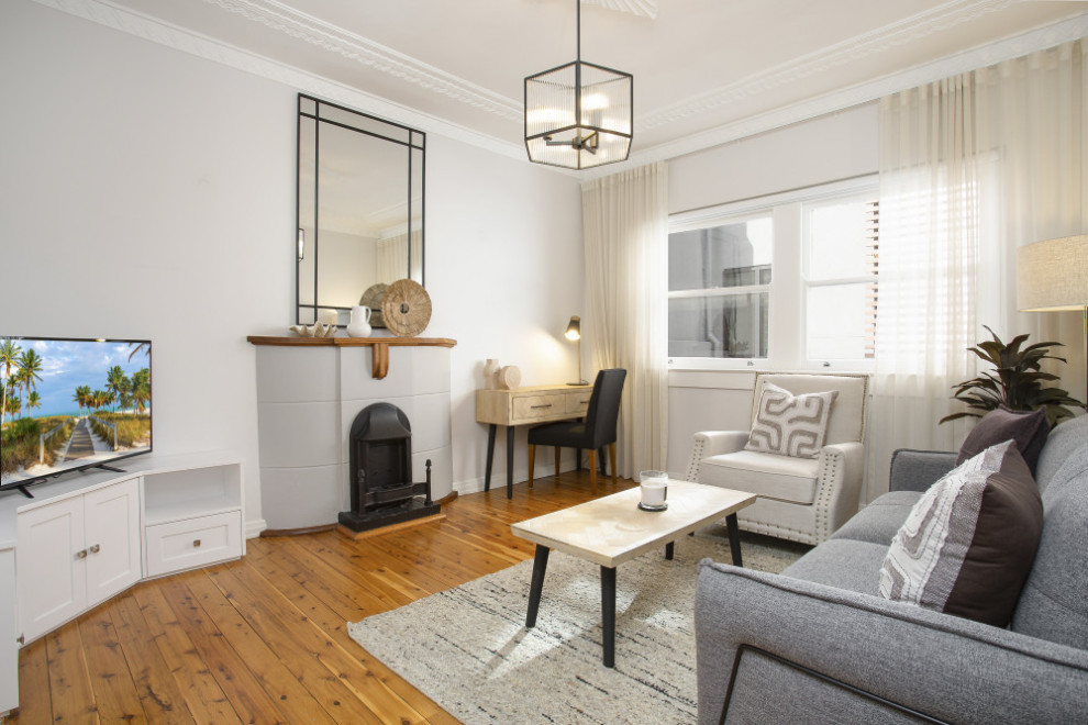 This is an example of a beach style living room in Sydney.