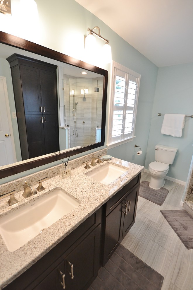 Large transitional master beige tile and ceramic tile ceramic tile home design photo in Philadelphia with raised-panel cabinets, white cabinets, a one-piece toilet, beige walls, an undermount sink and granite countertops