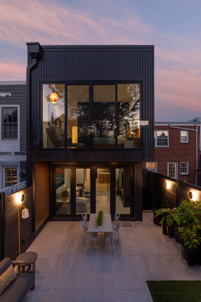 Small contemporary gray two-story concrete fiberboard and board and batten exterior home idea in DC Metro