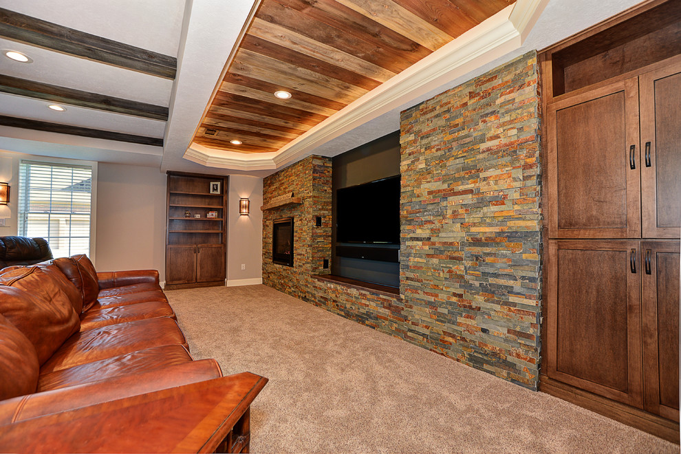 Mid-sized country walk-out basement in Other with carpet, a standard fireplace and a stone fireplace surround.