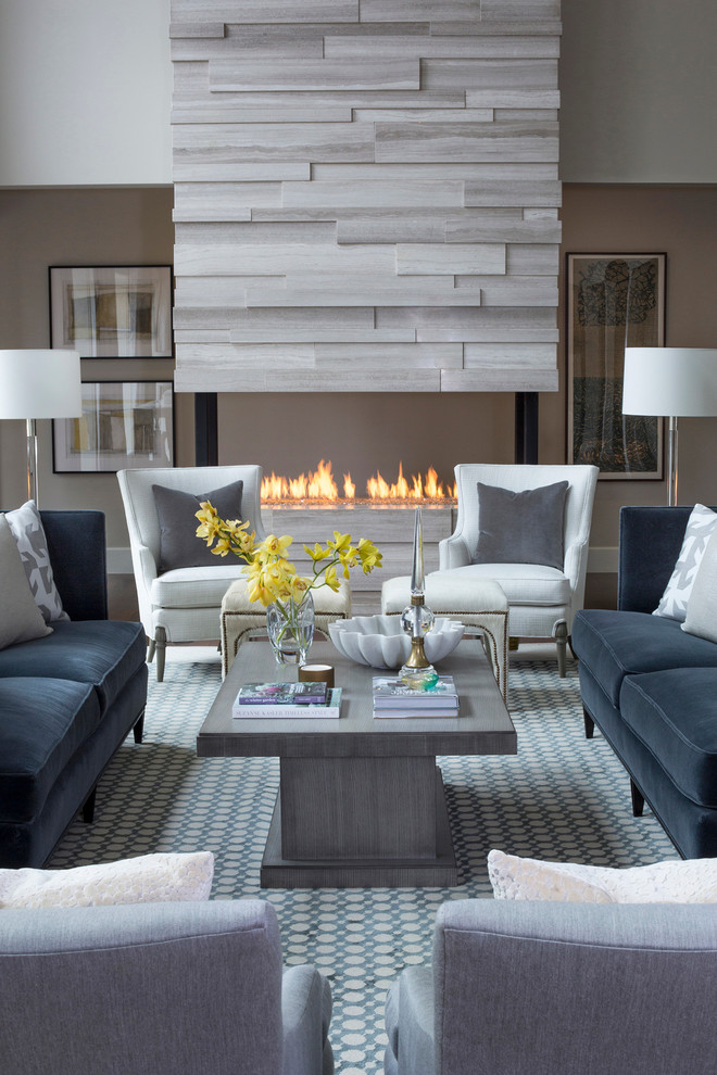 Photo of a transitional formal living room in Other with grey walls, a stone fireplace surround, no tv and a ribbon fireplace.