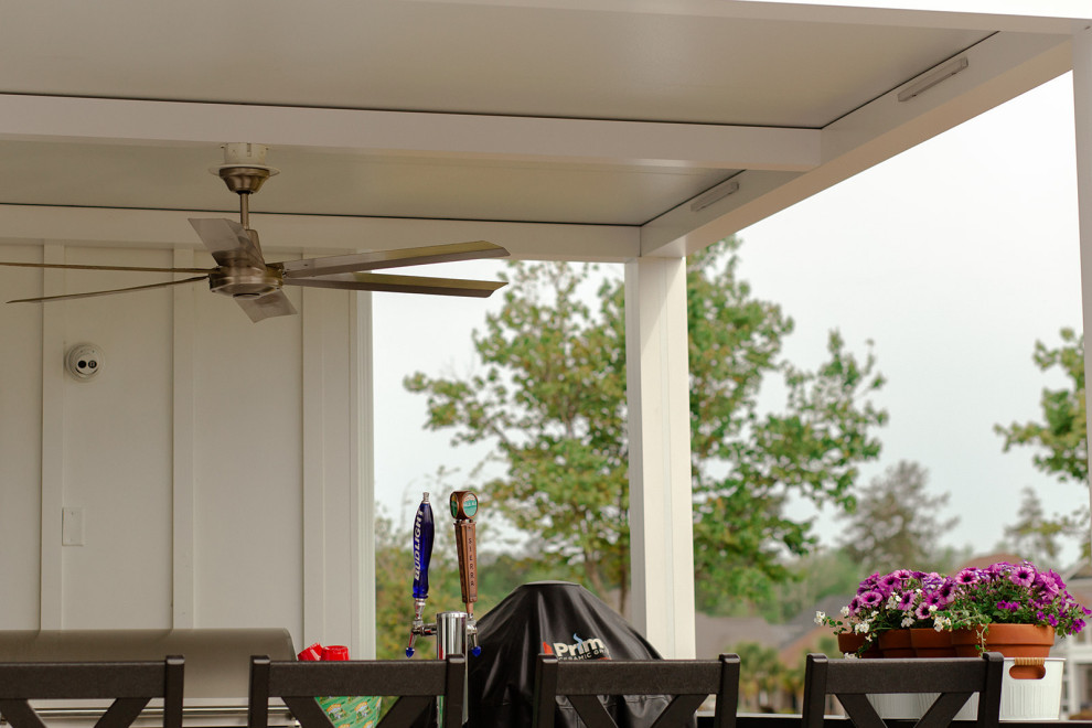 Photo of a small traditional backyard verandah in Wilmington with an outdoor kitchen, tile and a pergola.