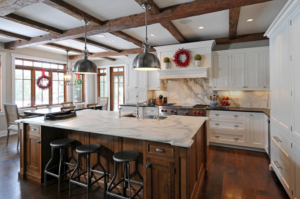 Traditional l-shaped kitchen in Chicago with recessed-panel cabinets and white cabinets.