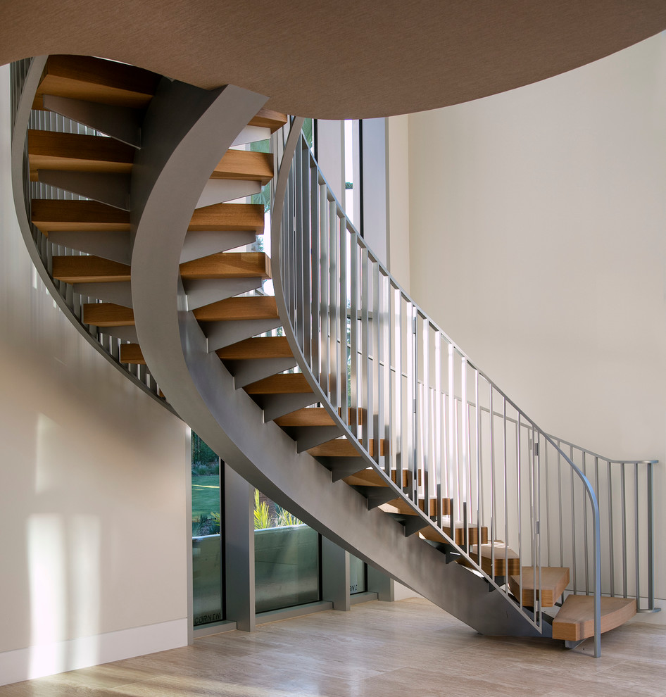 Design ideas for a modern wood staircase in Santa Barbara with open risers.