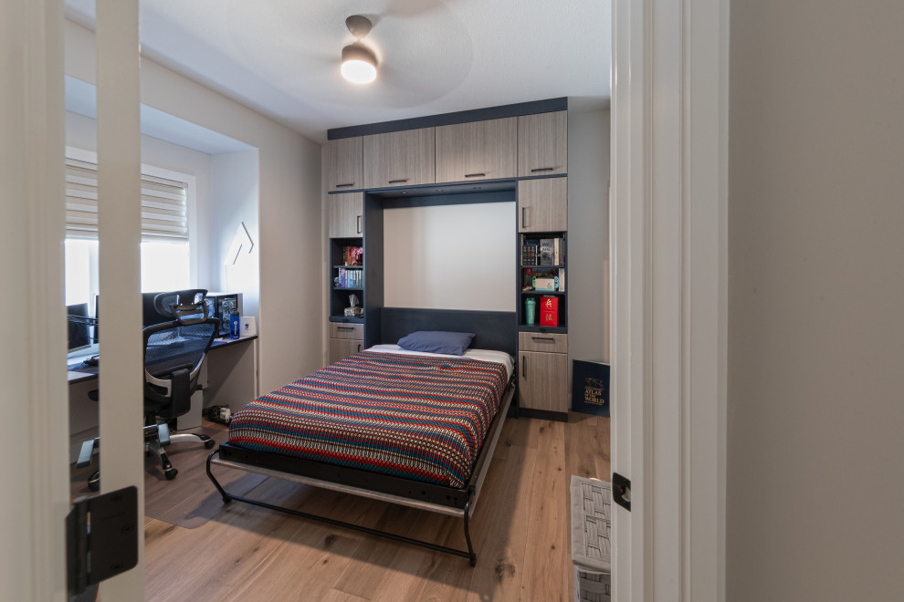 Cette photo montre une chambre d'amis nature de taille moyenne avec un mur blanc, un sol en vinyl et un sol marron.