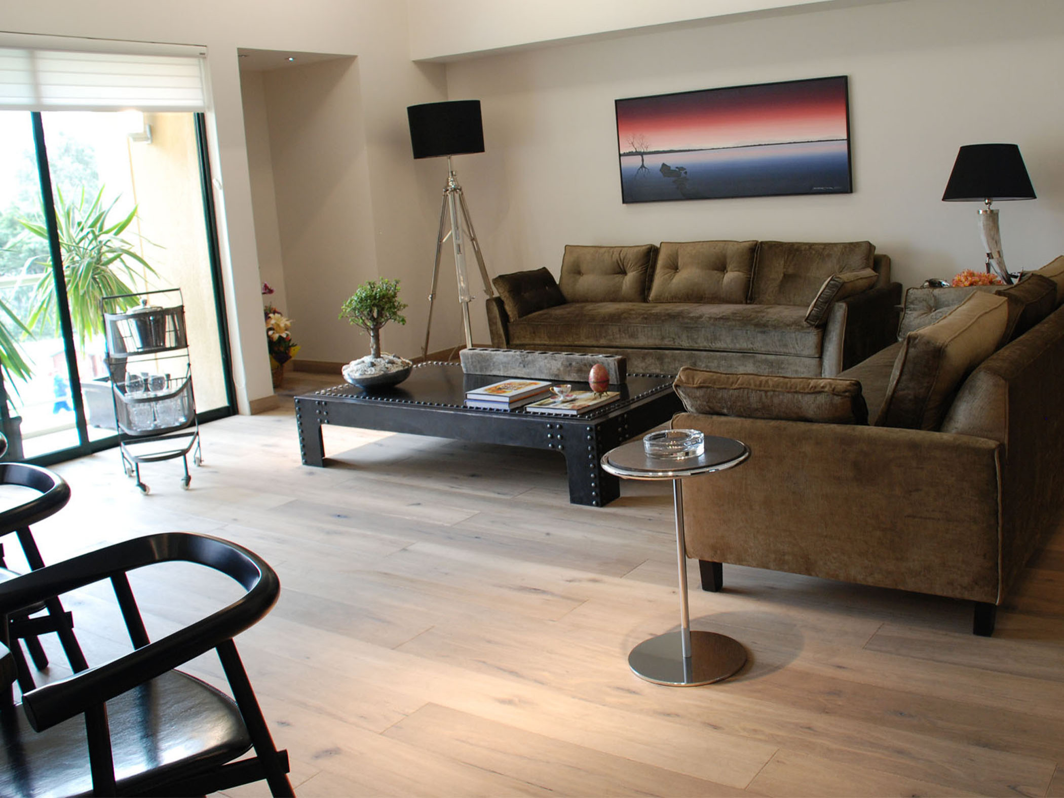 Example of a mid-sized transitional formal and open concept light wood floor living room design in San Francisco with beige walls