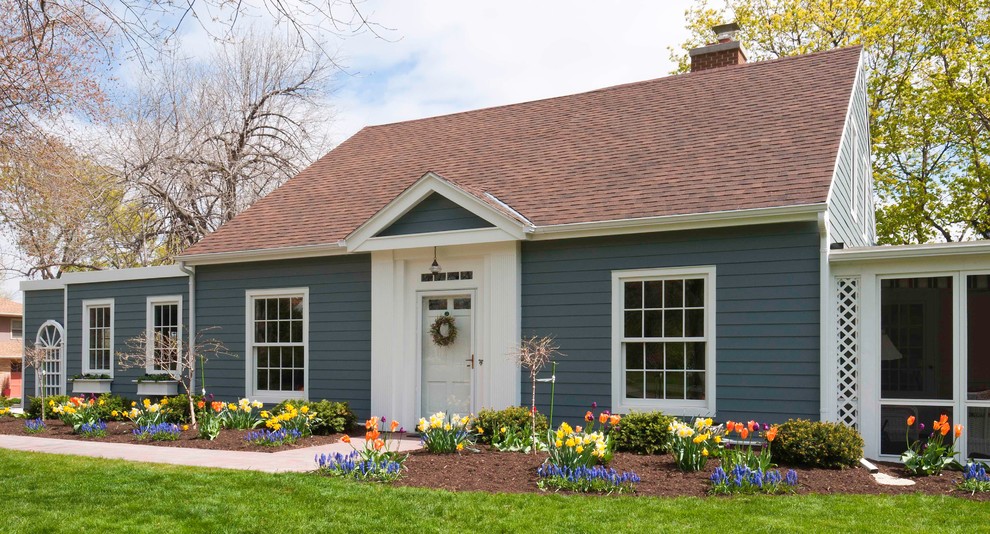 Mid-sized elegant blue two-story metal and clapboard gable roof photo with a shingle roof and a brown roof