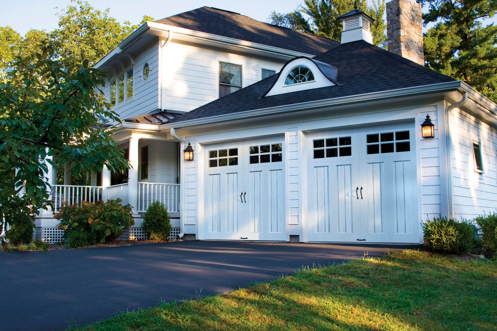 This is an example of a large traditional attached two-car garage in Philadelphia.
