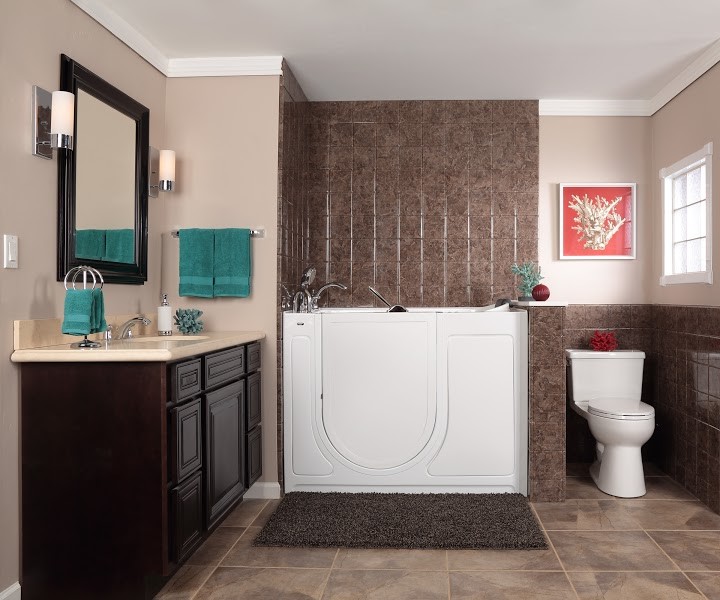 Inspiration for a mid-sized modern 3/4 bathroom in Wichita with recessed-panel cabinets, dark wood cabinets, a japanese tub, a two-piece toilet, beige tile, brown tile, ceramic tile, beige walls, ceramic floors, an undermount sink and solid surface benchtops.