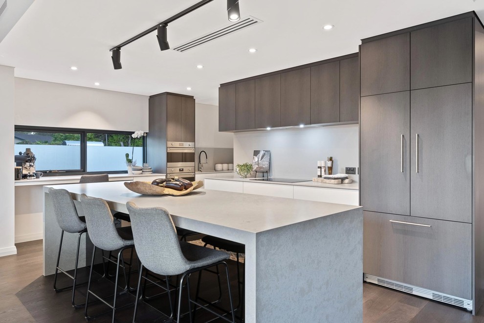 Inspiration for a contemporary kitchen in Perth with flat-panel cabinets, brown cabinets, grey splashback, panelled appliances, dark hardwood floors, with island, brown floor and grey benchtop.