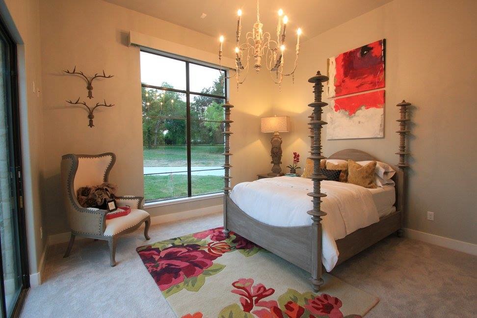 Inspiration for a transitional guest bedroom in Austin with grey walls and carpet.
