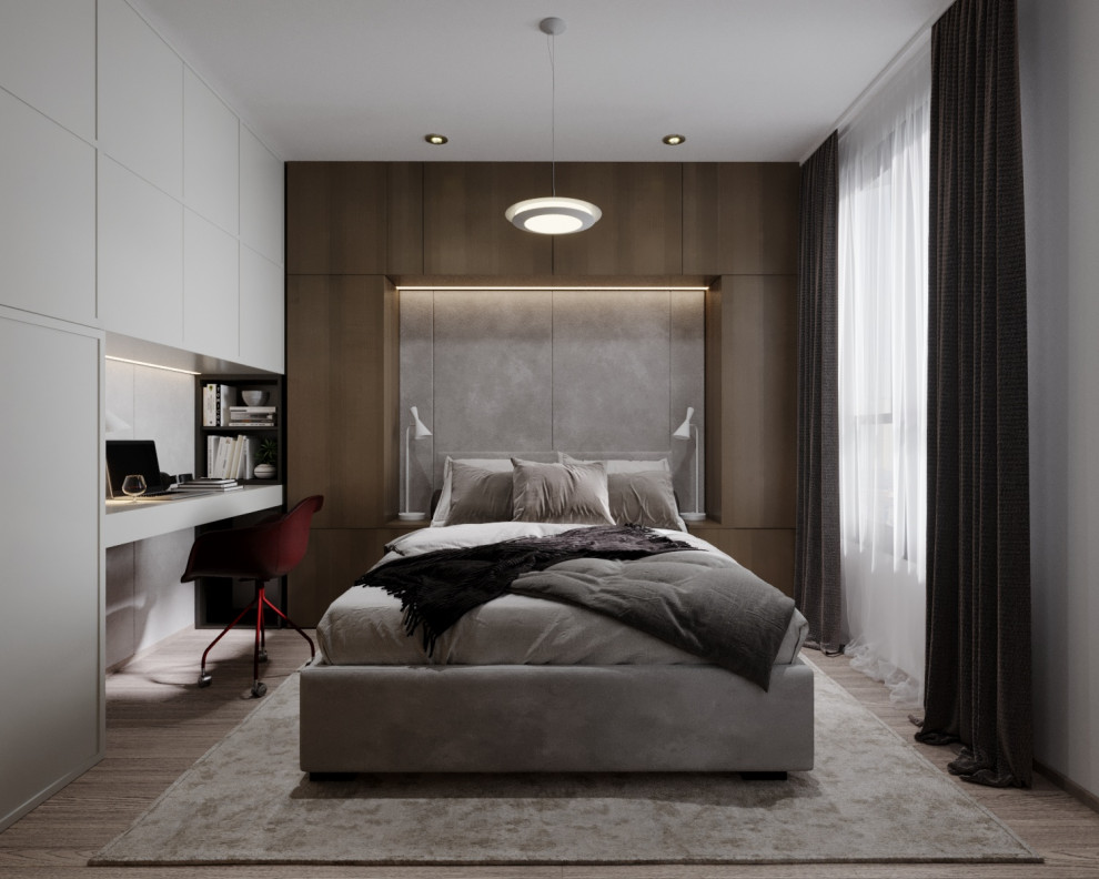 Cette image montre une petite chambre parentale minimaliste avec un mur blanc, sol en stratifié et un sol marron.