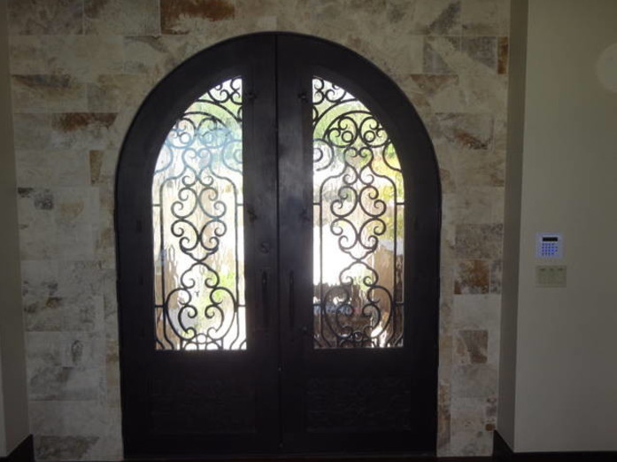 Mid-sized transitional front door photo in Orange County with beige walls and a dark wood front door