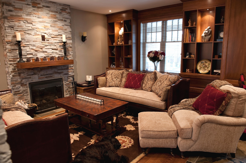 Photo of a mid-sized arts and crafts open concept living room in Toronto with beige walls, slate floors, a standard fireplace and a stone fireplace surround.