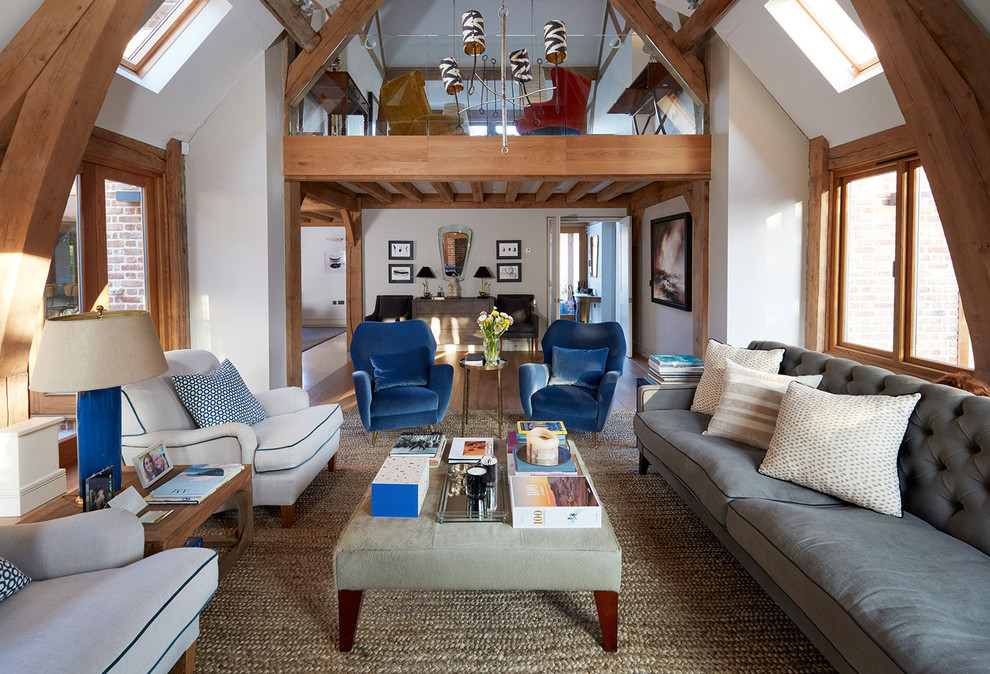 Photo of a mid-sized transitional loft-style living room in Other with white walls.