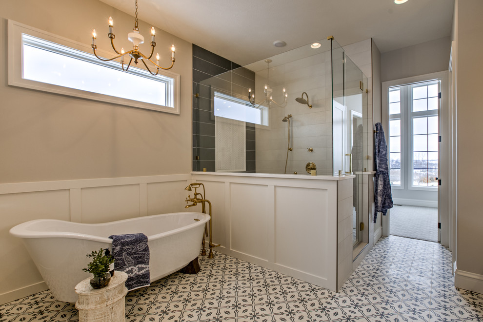 Inspiration for a large country master bathroom in Omaha with a freestanding tub, a corner shower, black and white tile, white tile, grey walls, multi-coloured floor, a hinged shower door, recessed-panel cabinets, white cabinets, ceramic tile, cement tiles, a vessel sink and white benchtops.