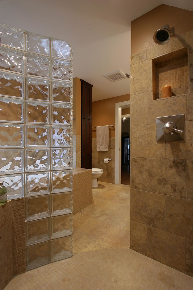 Inspiration for a large traditional master bathroom in Other with an alcove shower, orange walls, beige tile, stone tile, travertine floors, shaker cabinets, dark wood cabinets, a drop-in tub, an undermount sink, granite benchtops, brown floor, an open shower, orange benchtops, a shower seat, a double vanity, a built-in vanity and decorative wall panelling.