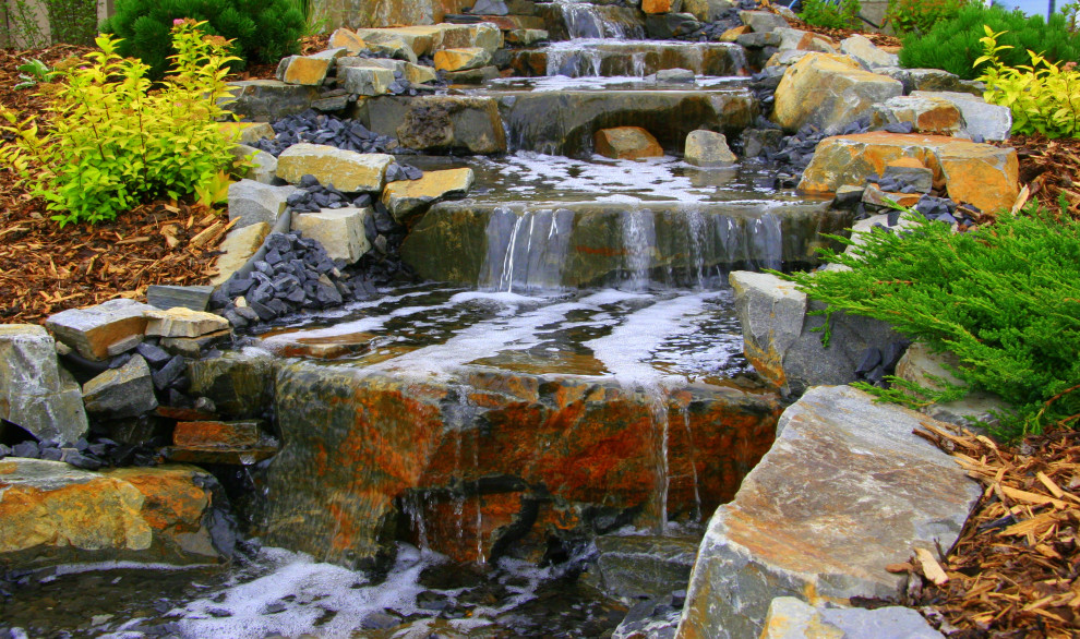 Photo of a rustic backyard pond in Edmonton.