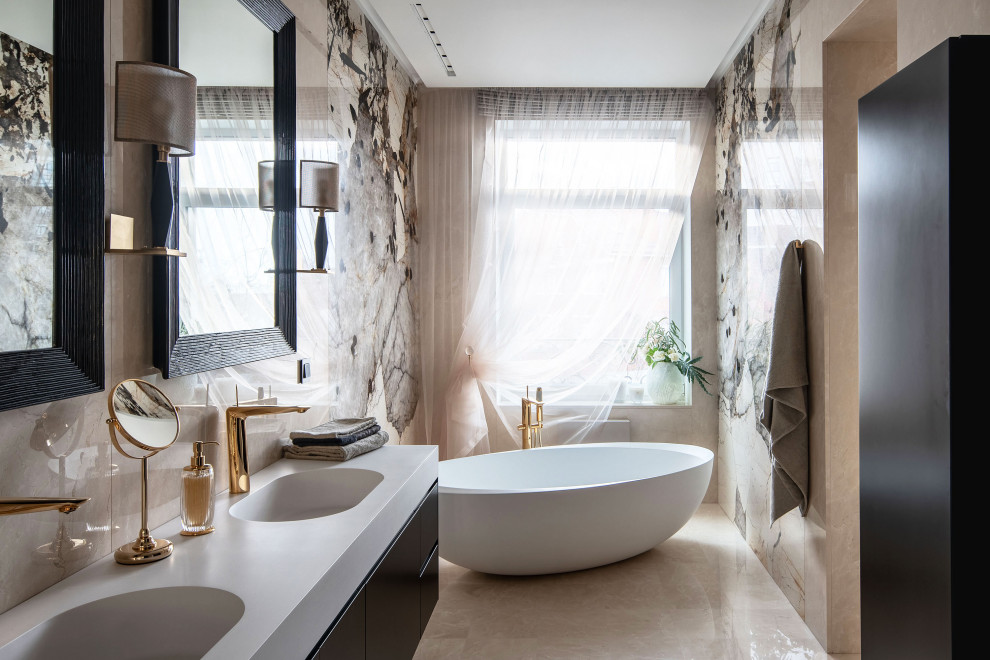 Large contemporary master bathroom in Other with flat-panel cabinets, grey cabinets, a freestanding tub, beige tile, black tile, ceramic floors, an integrated sink, beige floor and white benchtops.