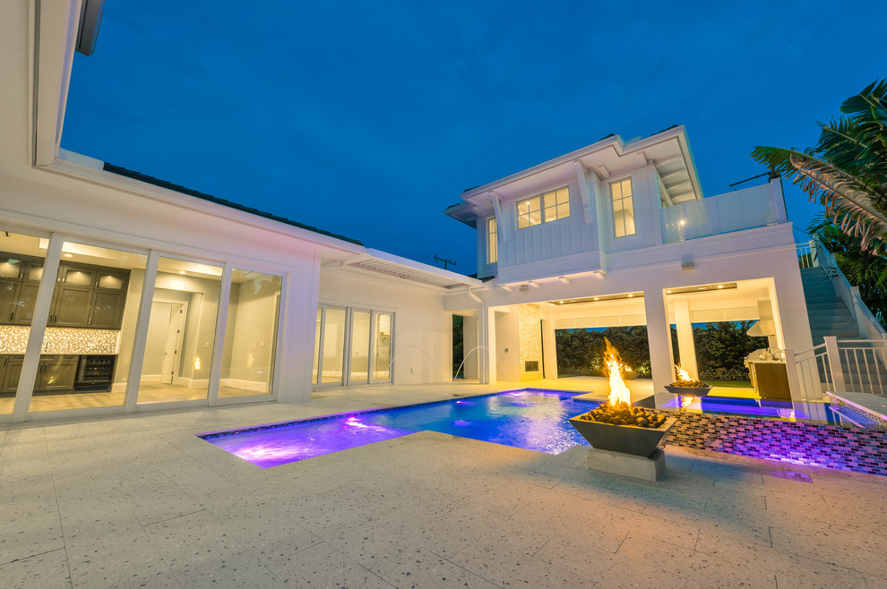 Pool fountain - large courtyard stone and custom-shaped pool fountain idea