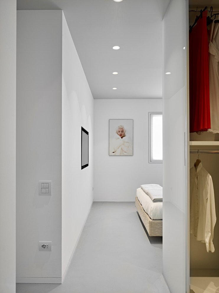 Contemporary master bedroom in Other with white walls.