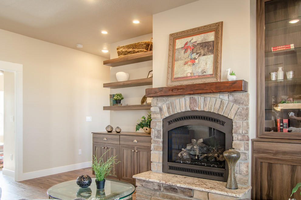 Inspiration for an expansive country open concept living room in Salt Lake City with brown walls, a standard fireplace and a stone fireplace surround.