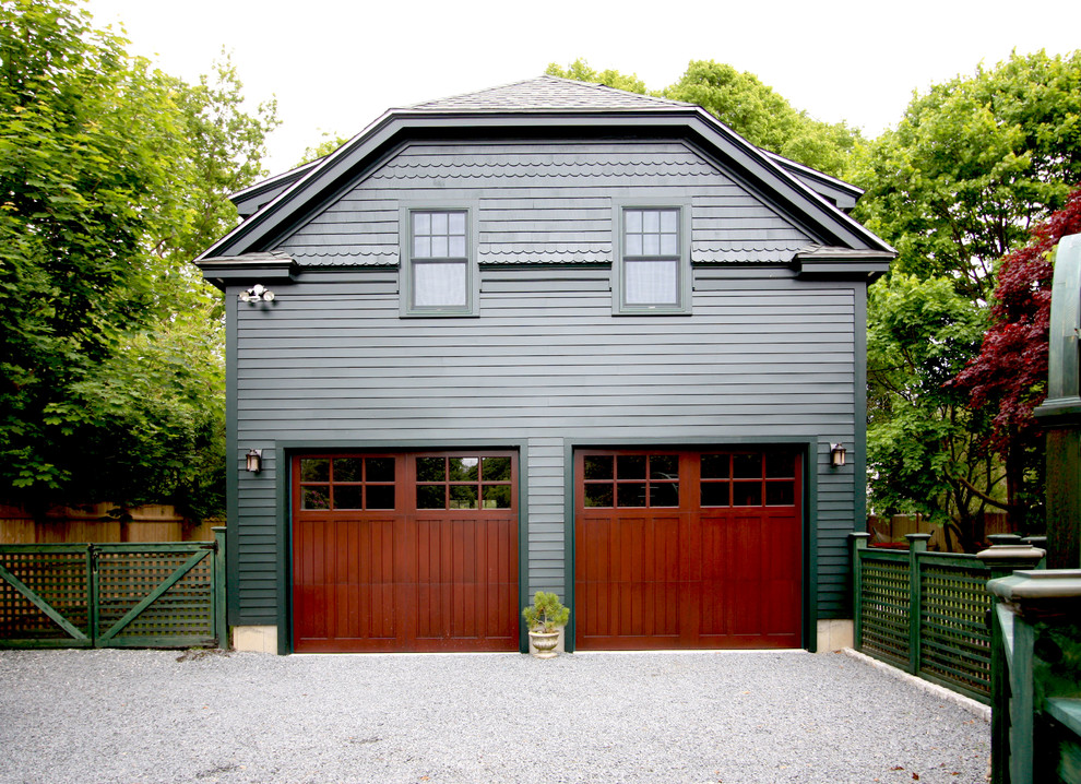 Photo of a traditional detached two-car garage in Providence.