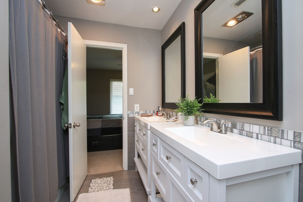 Traditional bathroom in Other with white cabinets, multi-coloured tiles, glass tiles, grey walls, porcelain flooring, engineered stone worktops, grey floors, white worktops, double sinks and a freestanding vanity unit.