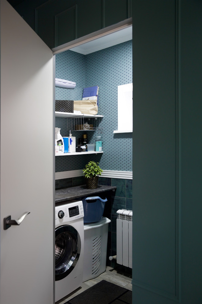 Design ideas for a small u-shaped laundry cupboard in Other with laminate benchtops, green walls, porcelain floors, grey floor and grey benchtop.